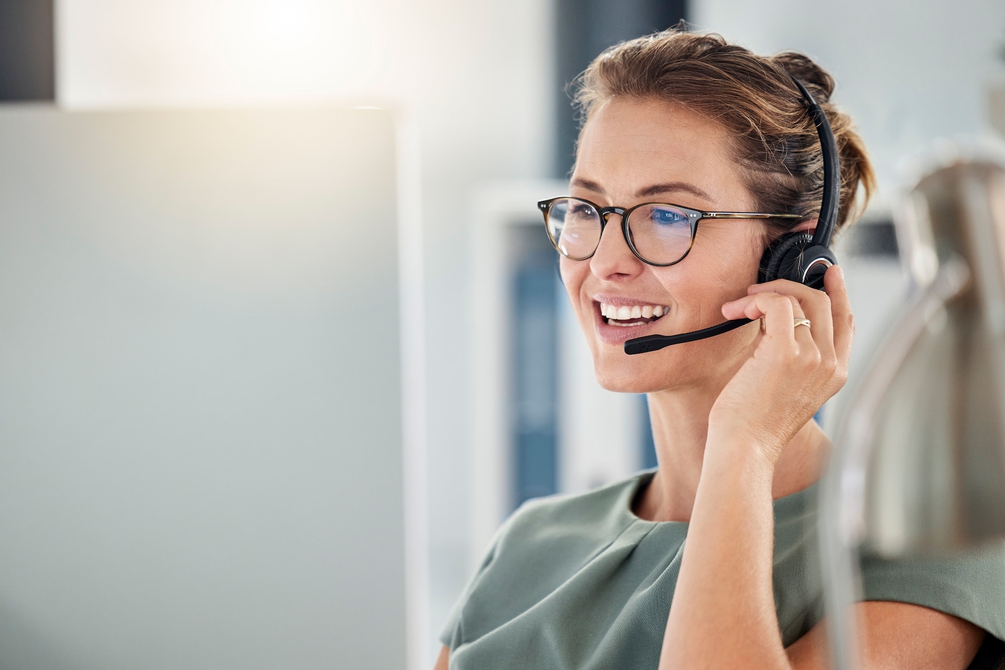 Happy call center woman consulting customer for customer support, help or telemarketing sales. Sale
